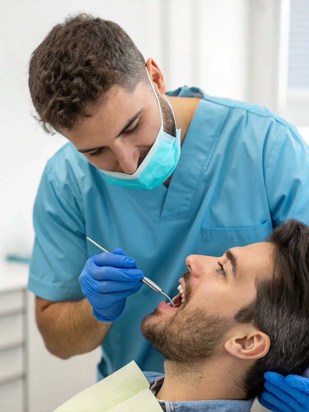 A dentist carefully handling a knocked-out tooth, with preservation solution nearby, emphasizing Advancedental1's prompt and expert care.